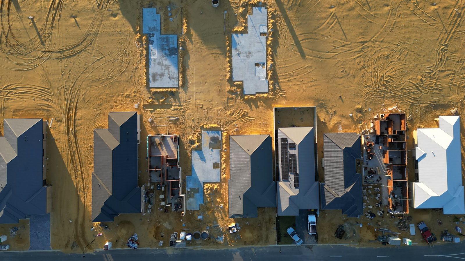 Aerial view of a residential construction site, the community development work HUD Section 4 capacity-building funds enable